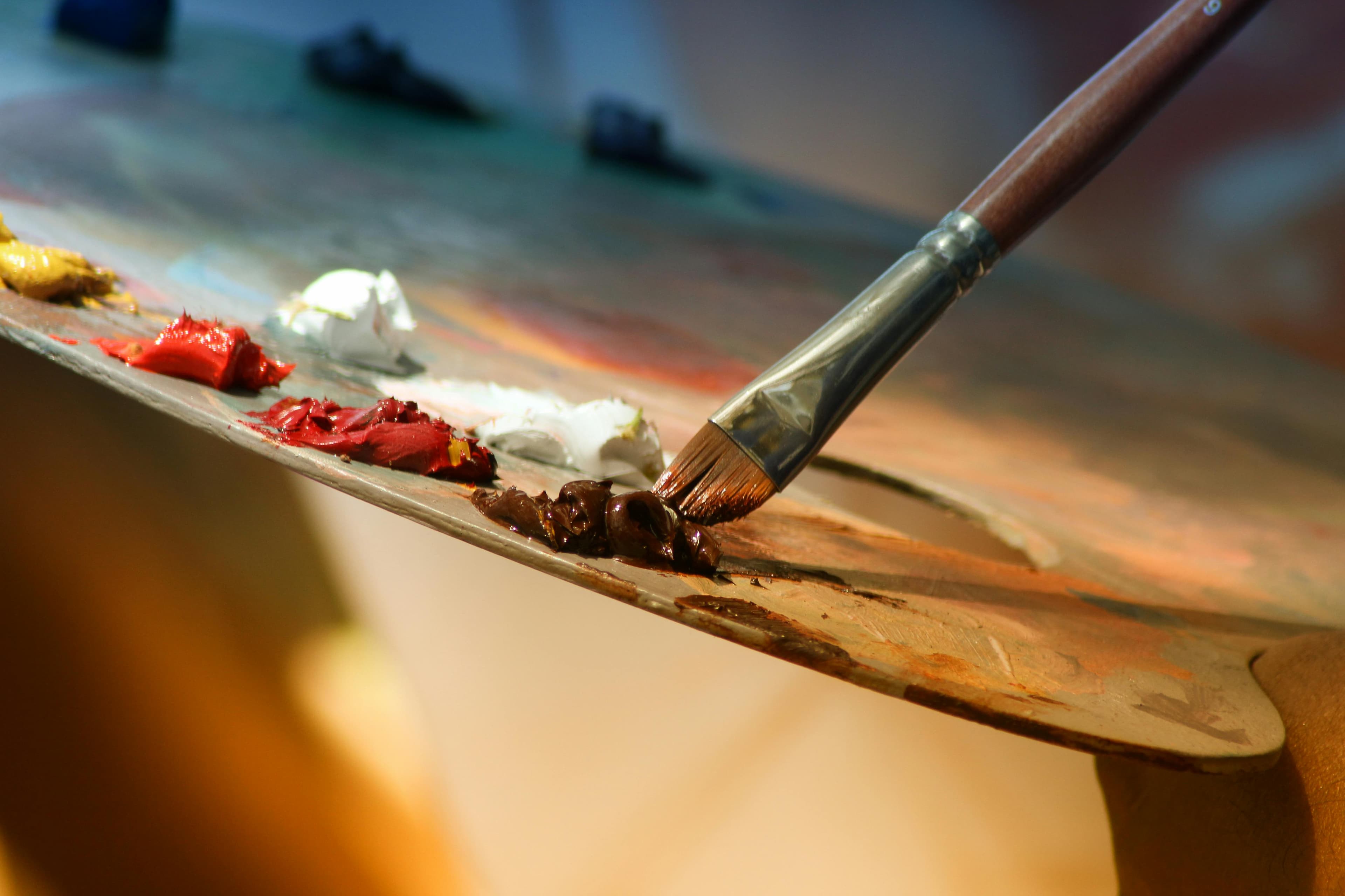 Artist's paint palette with brushes